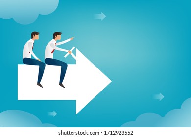 The young businessman pointed in the direction he was heading, 2 businessman sit on arrow 