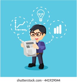 Young businessman reading a newspaper
