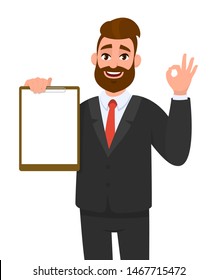 Young businessman showing blank clipboard and making okay, OK gesture sign. Person holding notepad. Male character design illustration. Human emotions, facial expressions concept in vector cartoon.