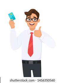 Young businessman showing credit, debit, ATM card and making thumb up gesture sign. Person holding digital payment card. Male character design illustration. Modern lifestyle, concept in cartoon style.