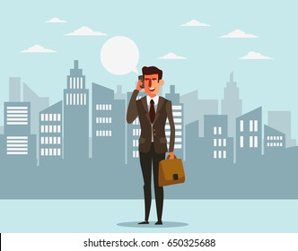 Young businessman talking on her phone in a city street