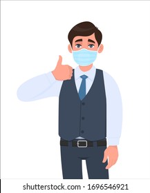 Young Businessman Wearing Medical Mask And Showing Thumbs Up Sign. Trendy Person In Waistcoat Covering Face Protection And Gesturing Good Symbol. Male Character Cartoon Illustration Design In Vector.