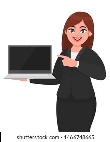 Young businesswoman showing a new brand laptop and pointing finger. Person holding portable computer and gesturing hand. Female character design illustration. Latest technology in vector cartoon style