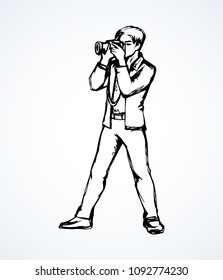 Young cameraman guy make snapshot session on white backdrop. Outline black ink hand drawn slr lens icon sign image picture sketchy in retro artistic doodle cartoon style pen on paper space for text