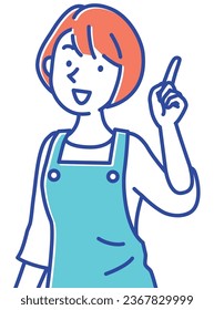 A young caregiver wearing an apron and pointing