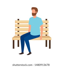 young and casual man with beard seated in park chair