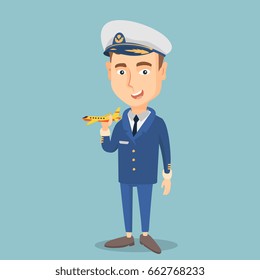 Young caucasian airline pilot holding a model of airplane in hand. Cheerful airline pilot in uniform. Smiling pilot with model of airplane. Vector flat design illustration. Square layout.