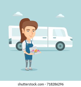 Young caucasian baker standing on the background of delivery truck. Female baker holding box with cupcakes. Smiling baker delivering cakes. Vector cartoon illustration. Square layout.