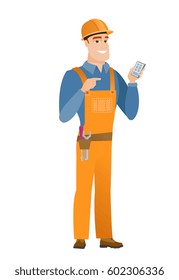 Young caucasian builder holding mobile phone and pointing at it. Full length of builder with mobile phone. Builder using mobile phone. Vector flat design illustration isolated on white background.