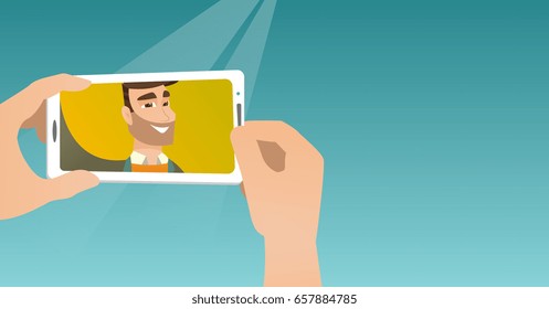 Young caucasian man making selfie. Smiling man taking a photo with a cellphone. Young guy taking selfie. Man taking selfie using his smartphone. Vector flat design illustration. Horizontal layout.