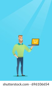 Young caucasian man using laptop for shopping online. Happy hipster man holding a laptop with a shopping trolley on screen. Man doing online shopping. Vector flat design illustration. Vertical layout.