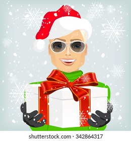 Young caucasian man wearing a santa hat offering a christmas gift decorated with a red ribbon, isolated on white background