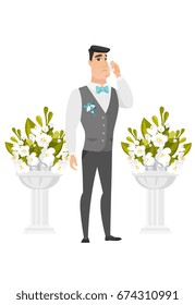 Young caucasian sorrowful groom in a suit crying during wedding ceremony. Groom waiting for a bride and crying in front of wedding altar. Vector flat design illustration isolated on white background.