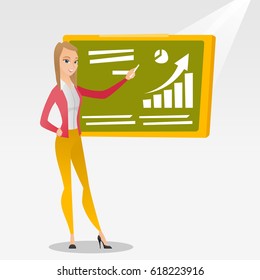 Young caucasian teacher standing in classroom. Teacher standing in front of the blackboard with a piece of chalk in hand. Teacher writing on chalkboard. Vector flat design illustration. Square layout.