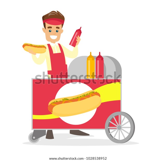 Young caucasian white street seller dressed in an\
apron standing with hot dog cart. Small business and street food\
concept. Vector cartoon illustration isolated on white background.\
Square layout.