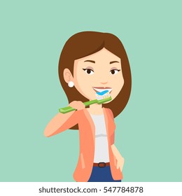 Young caucasian woman brushing her teeth. Smiling woman cleaning teeth. Cheerful woman taking care of her teeth. Happy girl with toothbrush in hand. Vector flat design illustration. Square layout.