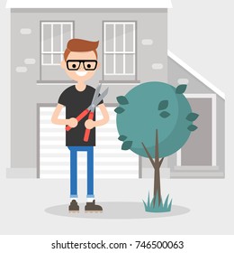 Young character cutting a bush with a pruner. Gardening. Seasonal work in a garden / flat editable vector illustration