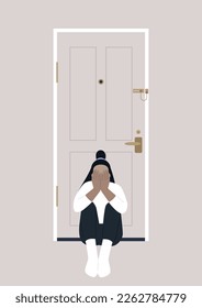 A young character sitting on the floor with their back turned to the entrance door