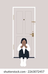 A young character sitting on the floor with their back turned to the entrance door