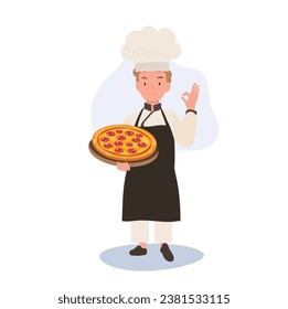 Young Chef Showing OK Sign. Happy Chef Doing OK Hand Sign and holding homemade pizza on tray in other hand