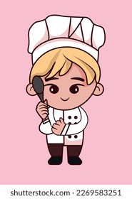 young chef with spoon in his hand