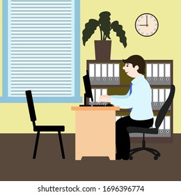 Young clerk at the table with computer in office interior.