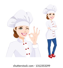 Young confident chef woman standing in uniform winking one eye and gesturing ok hand sign