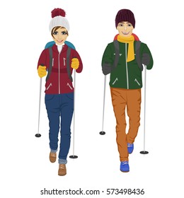 young couple with backpack and hiking walking sticks