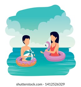 young couple with balloon and float on the beach