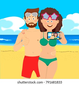 Young couple at the beach taking selfie picture