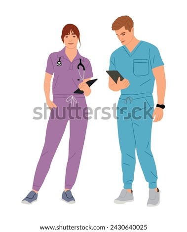 Young couple of doctors, nurses in medic scrubs.