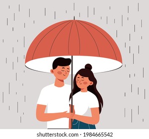 Young couple embrace each other with love and care. Happy man and woman hide from the rain under an open umbrella. Concept of the Valentine day