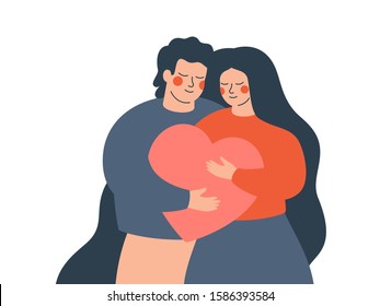 A young couple embraces each other with love and care. Happy woman and man hold a big heart together. Concept of the Valentine day and family day