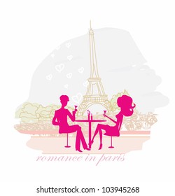 Young couple flirt and drink champagne in Paris
