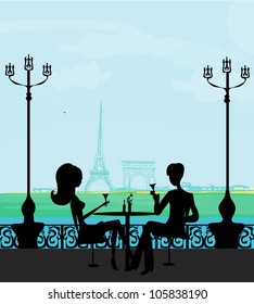 Young couple flirt and drink champagne in Paris