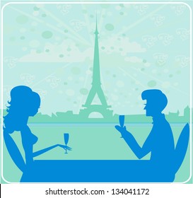 Young couple flirt and drink champagne in Paris
