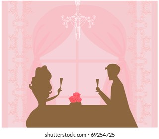 Young couple flirt and drink champagne
