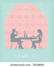 Young couple flirt and drink champagne