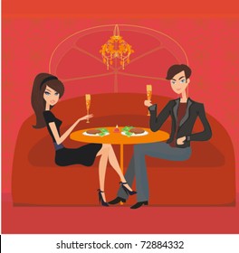 Young couple flirt and drink champagne