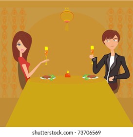 Young couple flirt and drink champagne