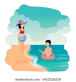 young couple with float and handbag on the beach