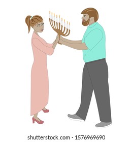 Young couple with hanukkah candles.