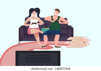 young couple holding joystick game pad happy family plying video games on tv man woman sitting on couch eating pizza male female characters having fun horizontal full length vector illustration