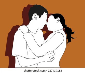 Young couple kiss and hug