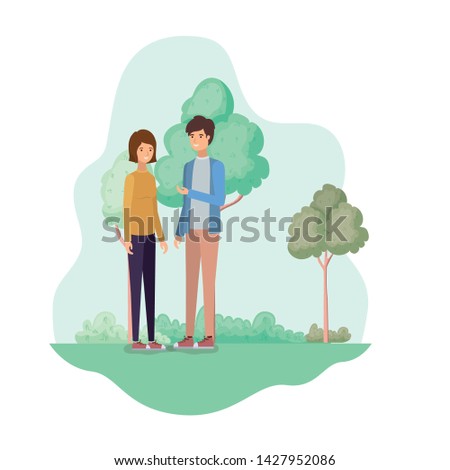 young couple in landscape with trees and plants