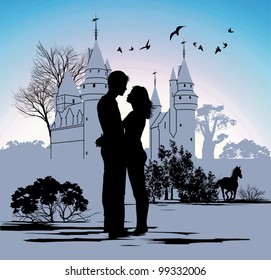 young couple looking at each other against the backdrop of the castle