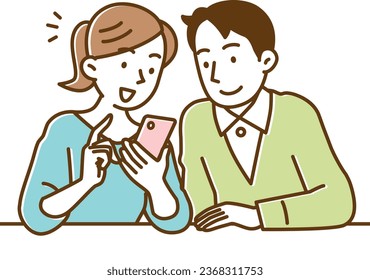 A young couple looking at their smartphones happily