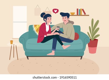 Young couple in love, chilling on sofa.