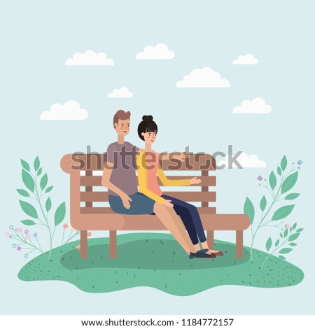 young couple lovers sitting on park chair
