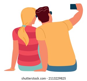 Young couple making selfie together. Back view